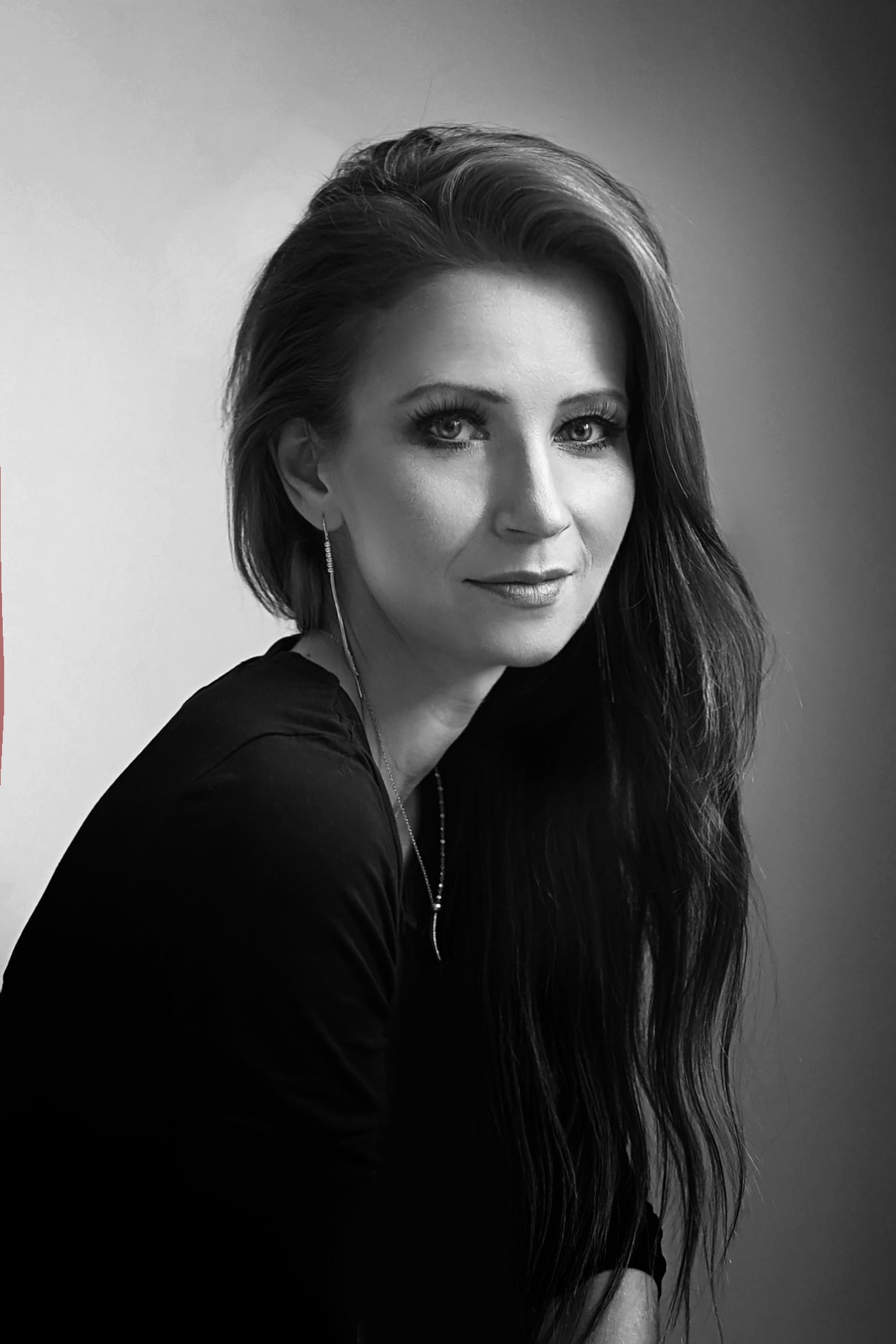 Black-and-white studio portrait of Kasia