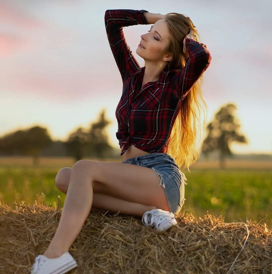 Kasia in a field at golden hour